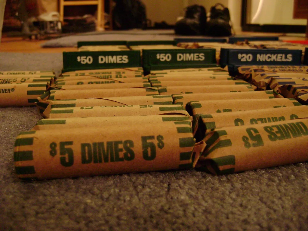 Rolls of U.S. dimes and nickels in paper coin wrappers