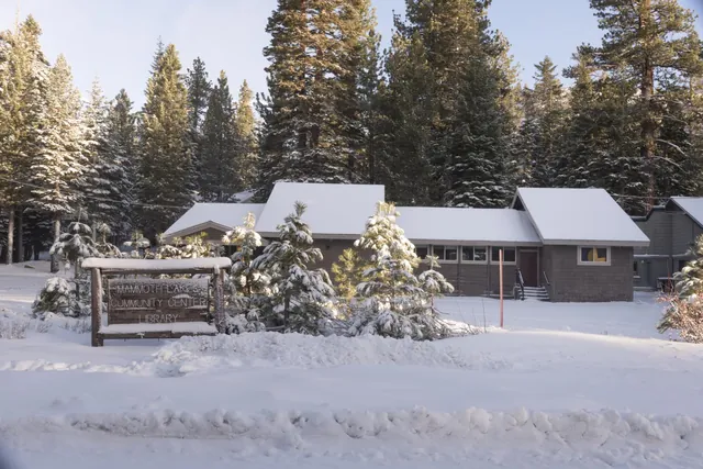 Mammoth Lakes community center and library surrounded by snow and pine trees