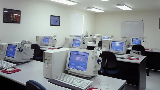 A computer lab with rows of desktop computers