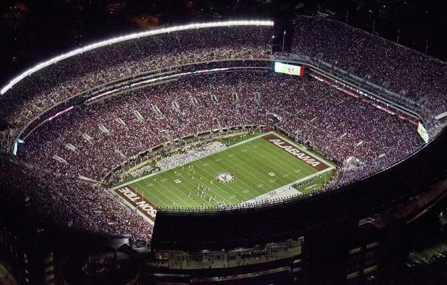 Aerial night view of a packed college football stadium in Tuscaloosa, Alabama