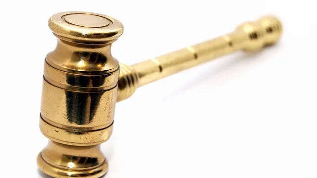 Brass gavel on a white background