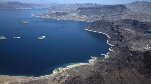 Aerial view of Lake Mead with exposed shoreline and desert mountains