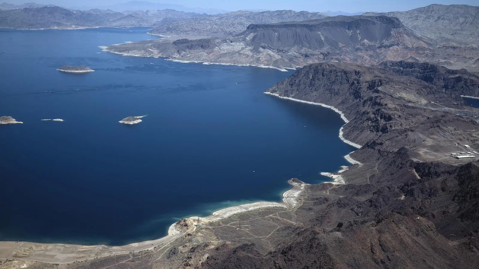 Aerial view of Lake Mead with exposed shoreline and desert mountains