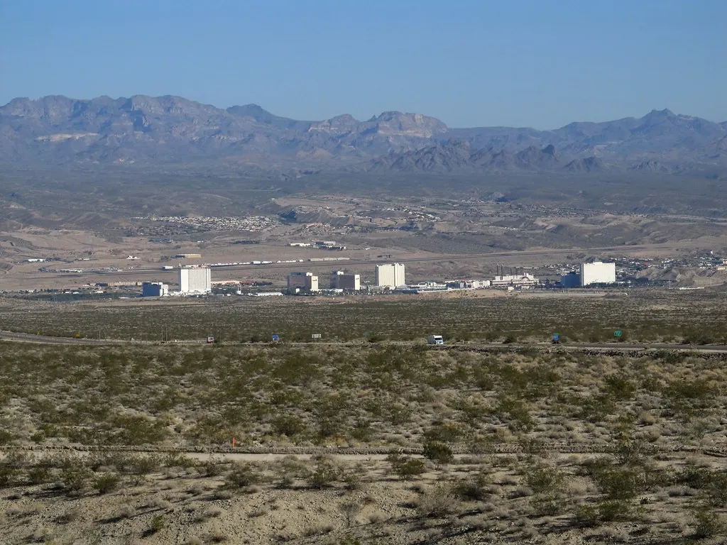 Laughlin, Nevada seen from State Route 163 across desert scrub, with mountains behind