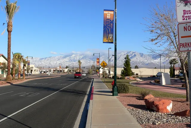 Street near city hall in Mesquite, Nevada, with snow-capped mountains in the distance