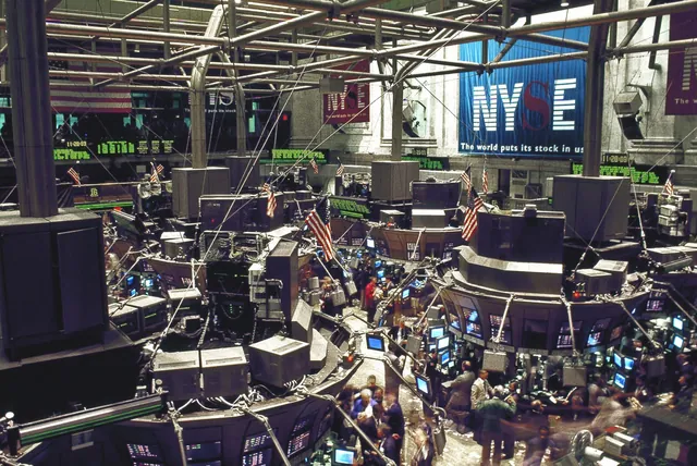 Trading floor of the New York Stock Exchange with banks of monitors