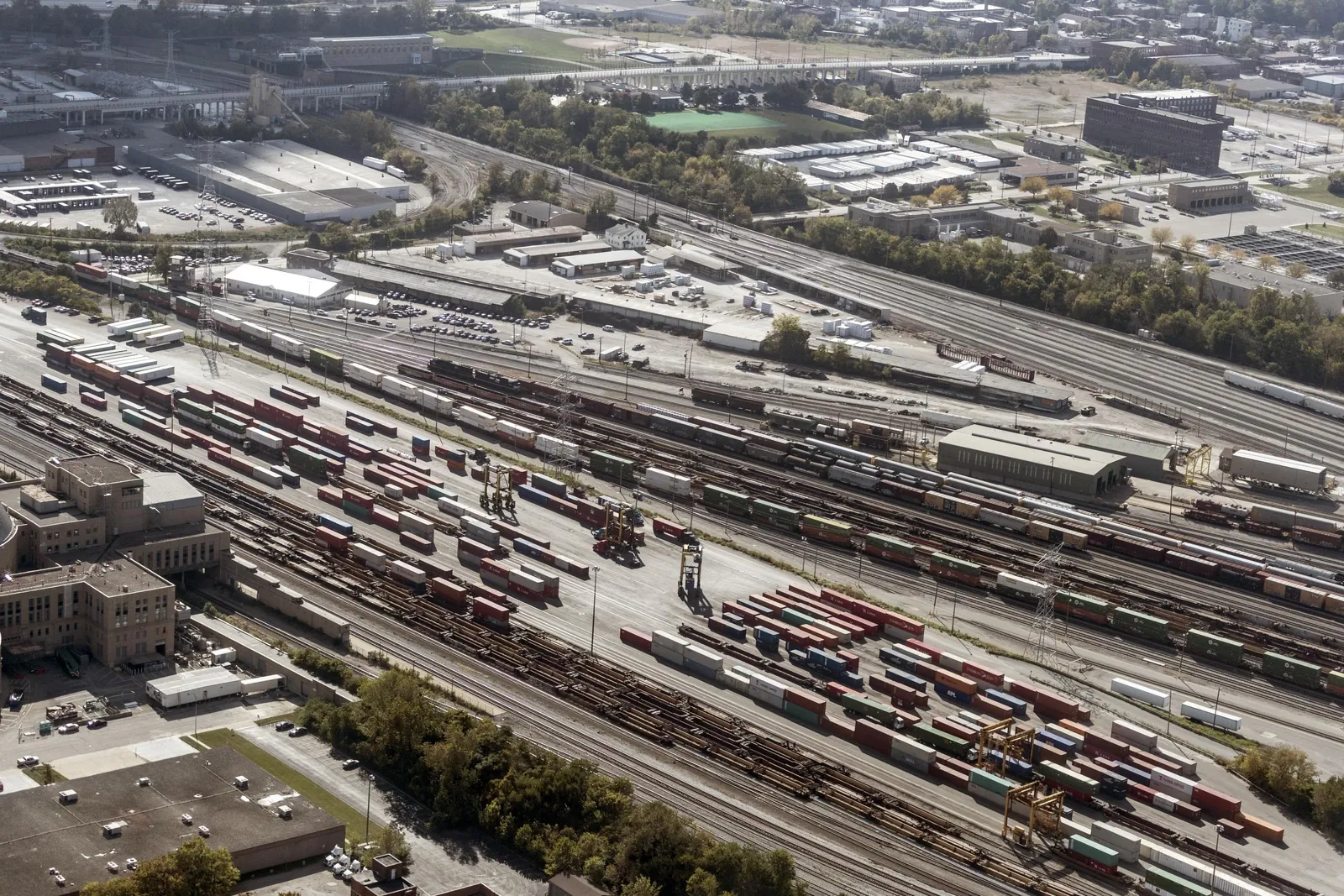Aerial view of a rail freight yard in Cincinnati with rows of freight cars