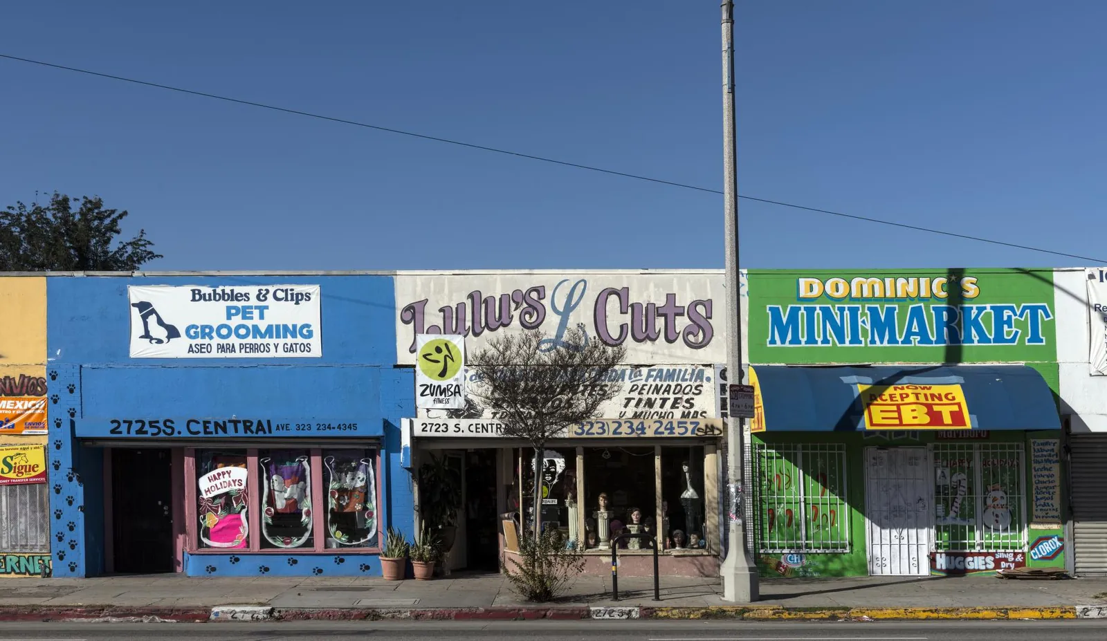 A row of small storefronts on a city street in Los Angeles